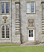 Carved stonework above side door of Capheaton Hall, Northumberland, UK