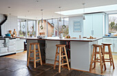 Bar stools and worktop in spacious Worcestershire kitchen, England, UK