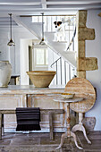 Antique furniture and stoneware in renovated Cotswolds cottage, UK