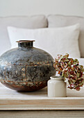 Indian water vase and old French mustard pot in West Sussex barn conversion, UK