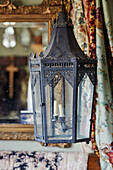 Old lamp and gilt framed mirror in Somerset home, UK