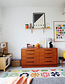 Wooden chest of drawers with shelf and toys in Sligo newbuild, Ireland