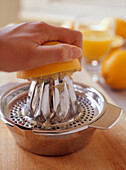 Preparing freshly squeezed orange juice