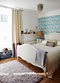 Floral turquoise wallpaper in Brighton bedroom East Sussex, England, UK