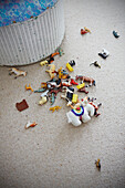Plastic animals on floor of boy's room in Colchester family home, Essex, England, UK