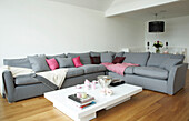 Open plan living room with L shaped sofa