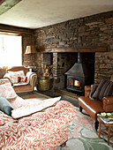 Sitting room with wood burning stove and Stonework walls
