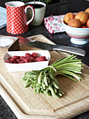 Wooden chopping board with fruit and vegetables