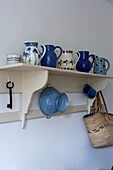 Shelving with a collection of crockery and tableware
