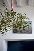 Mistletoe hanging in entrance hall, close-up