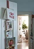 Christmas cards on door in house