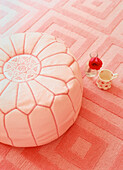 Cotton floor cushion and woven carpet in sugar pink