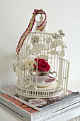 Decorative ornamental wirework bird cage with flower display