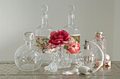 Display of vintage glass storage jars bottles and vases