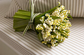Bouquet of white flowers on a sofa