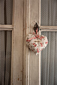 Heart shaped lavender bag tied to a door latch