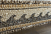 Seashell design on side of bath