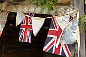Union Jack and bunting on exterior of Suffolk home, England, UK