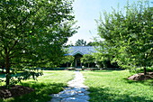 Garden path to entrance of rural Massachusetts home, New England, USA
