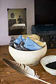 Assorted sachets with feather in ceramic bowls in Hastings home, East Sussex, England, UK