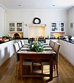 Dining table in a kitchen laid for Christmas lunch