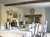 Crockery and chinaware on dining table in Gloucestershire farmhouse, England, UK