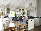 Wall mounted cabinets in open plan kitchen of Hampshire farmhouse, England, UK