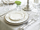Silver and chinaware place setting in Somerset home England UK
