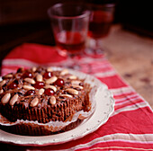Homemade fruit and nut cake on a plate on a country style tabletop