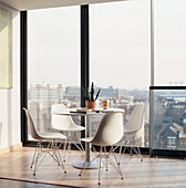 Open plan dining room in high rise apartment with large window