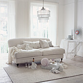 White living room with opened gifts on the floor