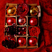 Box of red Christmas decorations 