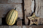 Vegetable and star shaped ornament in rustic barn interior, United Kingdom