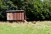 View of a rusty Shepherds hut in a field