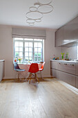DSW chairs at window in kitchen of contemporary London home England UK