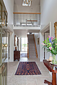 Double height hallway and entrance hall in Wiltshire country house England UK