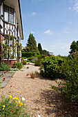 Gravel path at exterior of 1920s country house, Haslemere, Surrey, UK