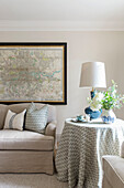 Framed map and sofa with co-ordinating fabrics in London home UK