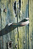 Old rusty handle on weathered door, Majorca, Spain