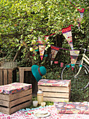 Crates with seat cushions bicycle and bunting London England UK