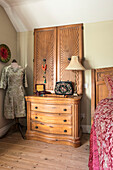 Dressmakers dummy and Art Nouveau shutters with antique chest of drawers in Farnham home Surrey UK