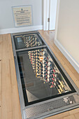 Underfloor wine cellar in converted London courthouse UK