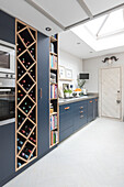 Wine and book storage in kitchen of Victorian terrace Wandsworth London Uk