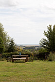 Picnic table in back garden with view over East Sussex countryside