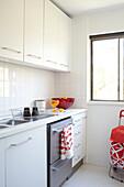 White fitted kitchen in Sydney apartment Australia