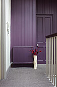 Muted purple paintwork on carpeted landing of contemporary Bristol home, England, UK