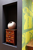 Vintage drawers and sculpture in niche of contemporary Isle of Wight home UK
