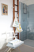 Drawstring bags and folded towels with ladder in Ryde bathroom Isle of Wight, UK