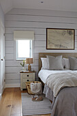 Shoes and basket with bedside table in wood clad Isle of Wight new build UK