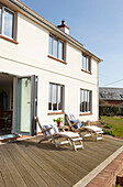 Sunloungers on decking of Isle of Wight new build UK